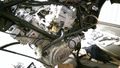 Motor mit der typischen Aluminiumkorrosion unter dem Klarlack. - im Hintergrund Gabelfeder Yamaha (eng) gegen Gabelfeder Wirth (weit)
